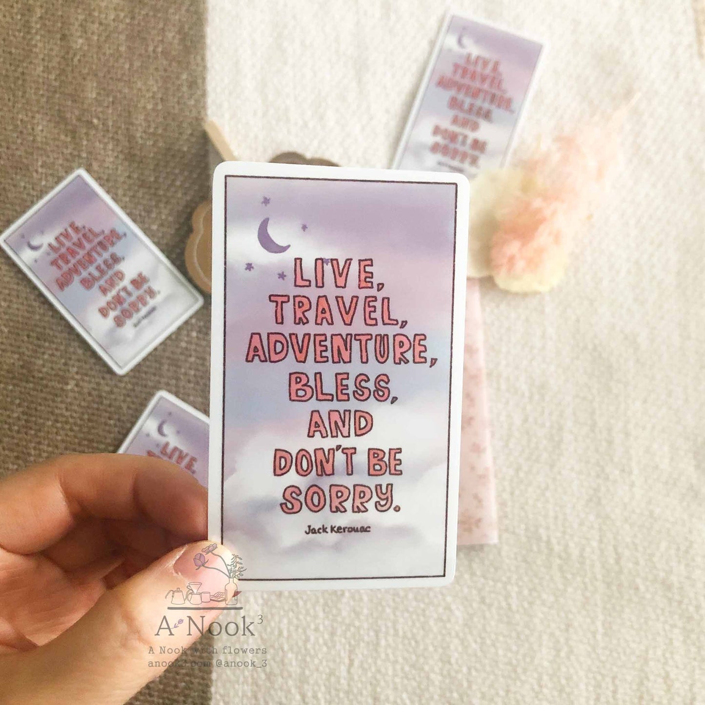 Inspirational Travel Adventure quotes are hand typographed and pink, lavender and sky blue skies with clouds are painted in watercolor. Weatherproof for your laptop, phone case, suitcase, mirror, planner, bullet journal, notebook, scrapbook